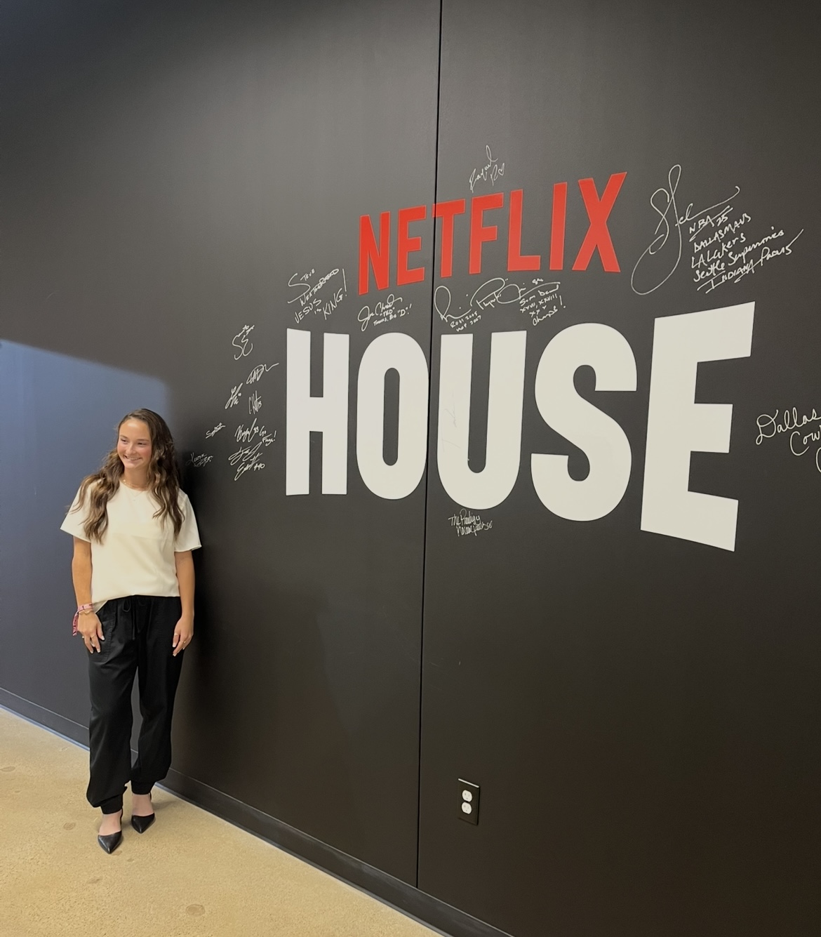 Dallas Trinity FC's Sealey Strawn Poses with her Netflix Wall Signature